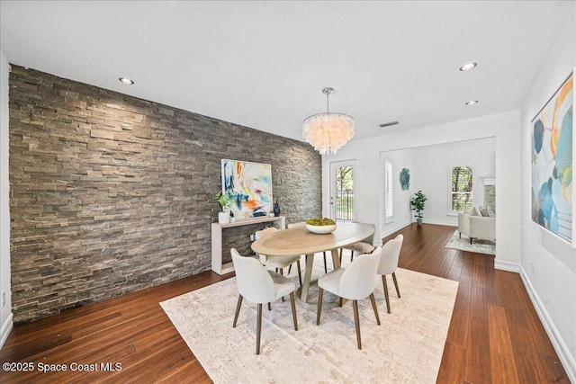 145 Crispin St, Merritt Island, FL 32952 - dining area featuring a chandelier, dark wood-style flooring, recessed lighting, and baseboards