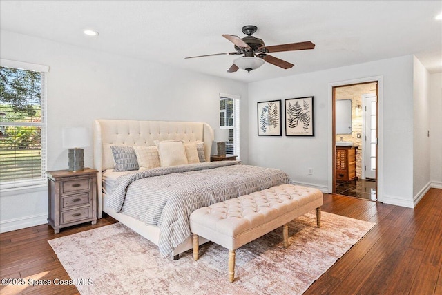 145 Crispin St, Merritt Island, FL 32952 - bedroom with baseboards, wood finished floors, ensuite bath, recessed lighting, and a ceiling fan