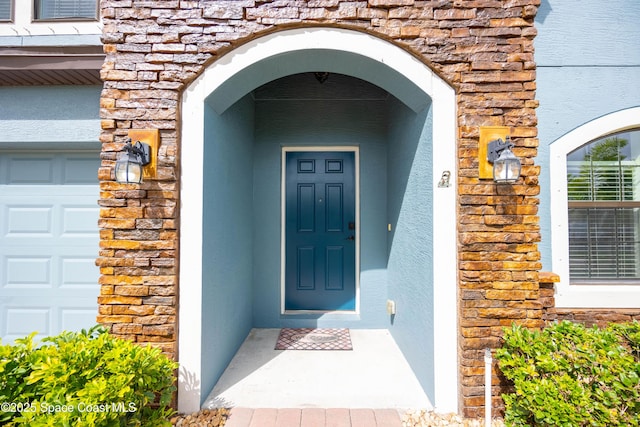 entrance to property featuring a garage