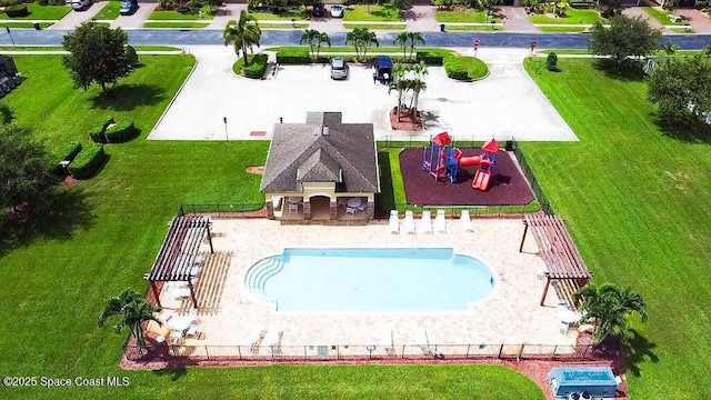 view of swimming pool with a patio area