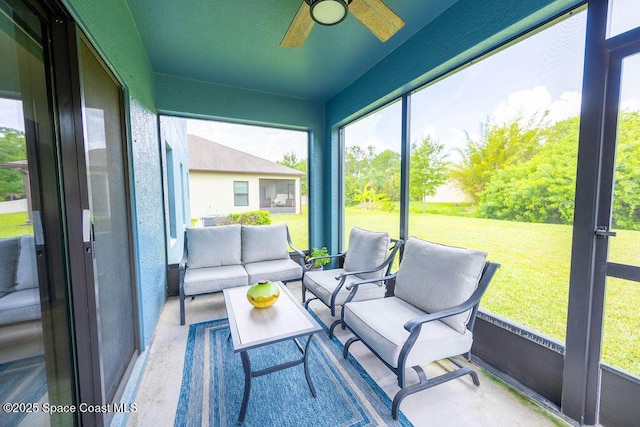 sunroom / solarium with ceiling fan and a healthy amount of sunlight