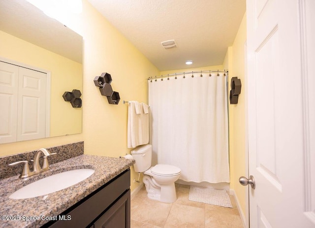 bathroom featuring a shower with curtain, tile patterned floors, vanity, and toilet