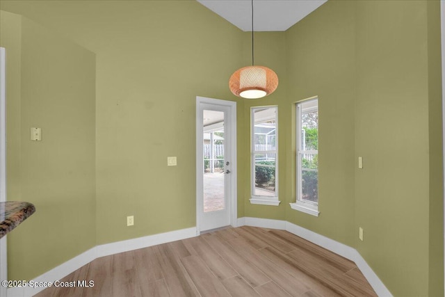 unfurnished dining area featuring light hardwood / wood-style flooring