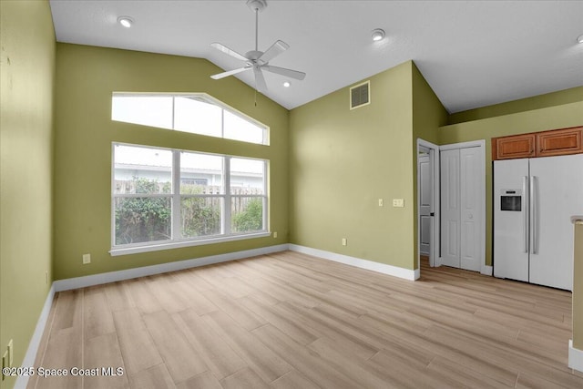 unfurnished living room featuring ceiling fan, light hardwood / wood-style flooring, and lofted ceiling