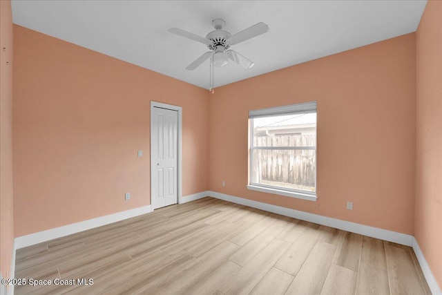 unfurnished room with ceiling fan and light hardwood / wood-style flooring