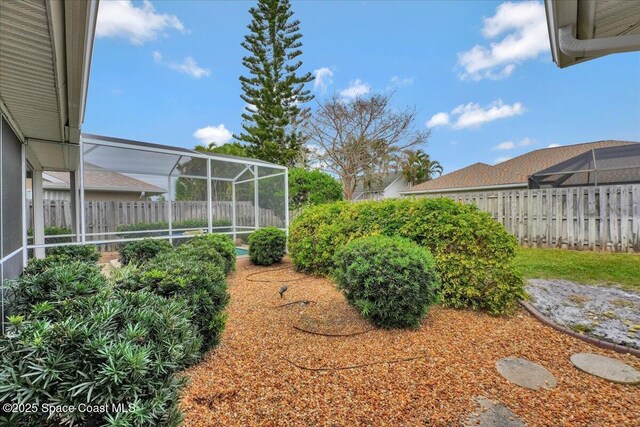 view of yard featuring a lanai