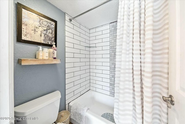 bathroom with toilet, a textured ceiling, and shower / bathtub combination with curtain