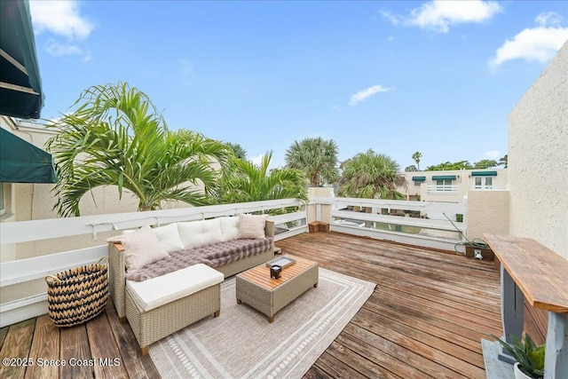 wooden deck featuring an outdoor hangout area