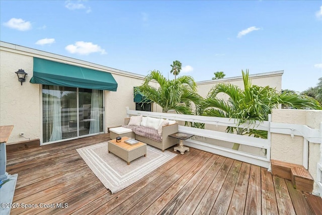 wooden deck featuring an outdoor living space