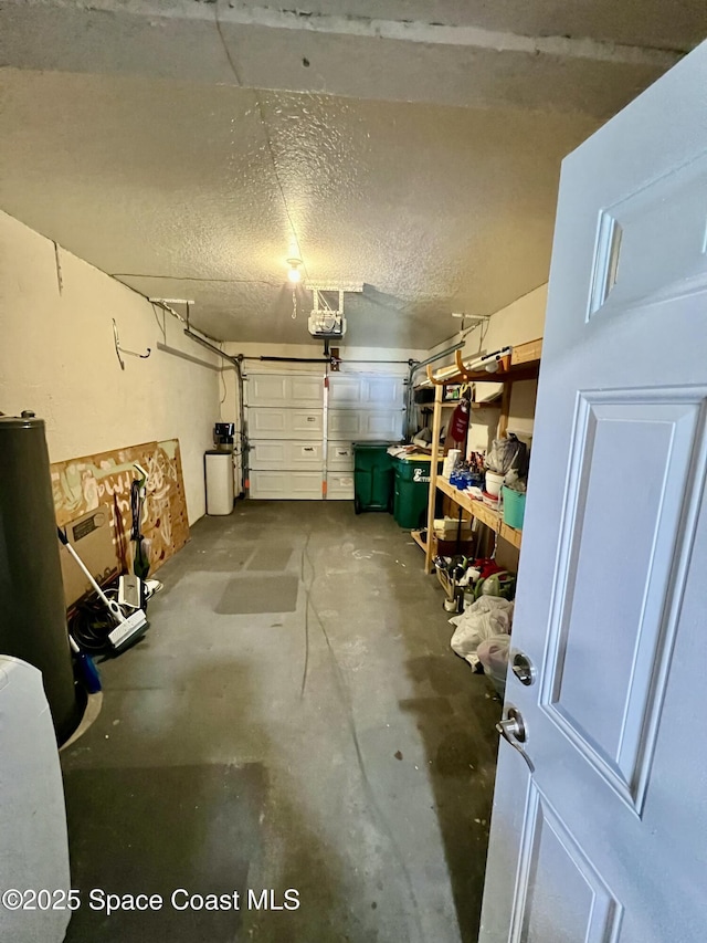 garage with a garage door opener and water heater