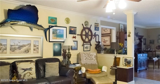 interior space with ceiling fan, light hardwood / wood-style flooring, crown molding, and decorative columns