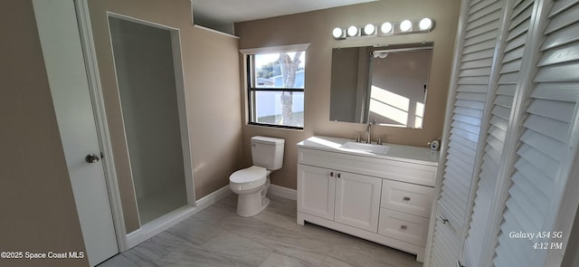 bathroom with toilet and vanity