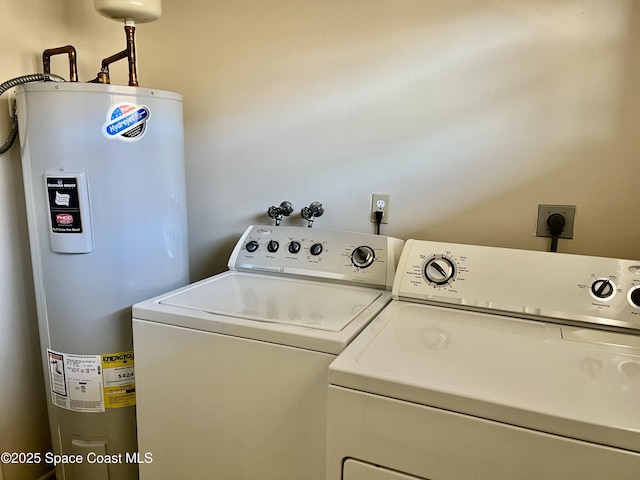 washroom featuring washer and clothes dryer and water heater