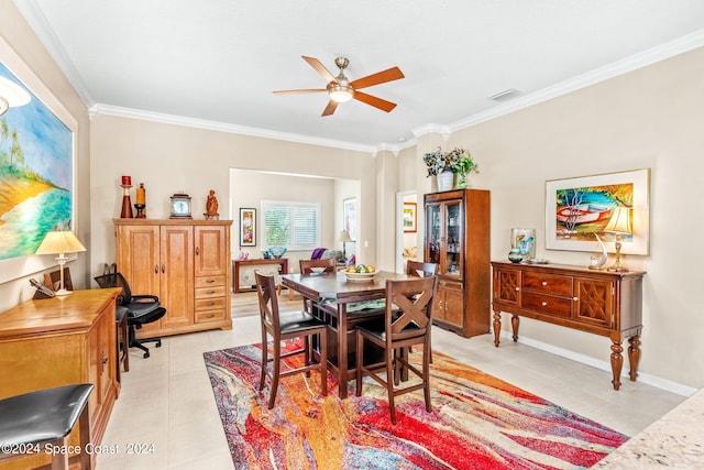 dining room featuring ceiling fan, light tile patterned flooring, and crown molding