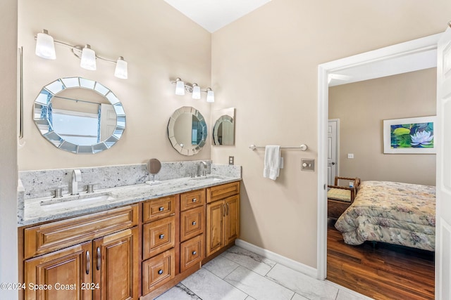 bathroom featuring tile patterned flooring and vanity