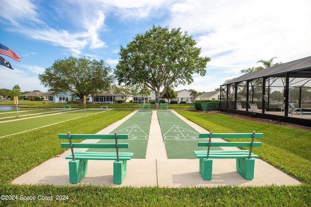 view of property's community with a yard