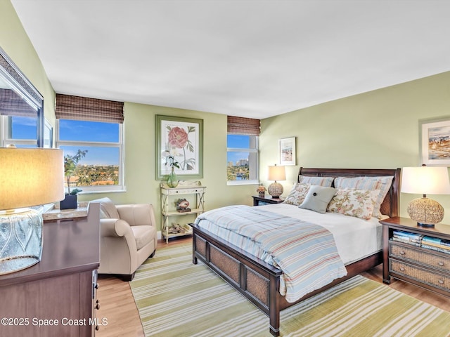 bedroom with light hardwood / wood-style flooring