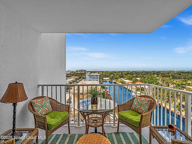 balcony featuring a water view