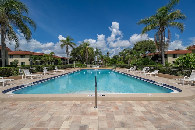 view of swimming pool with a patio