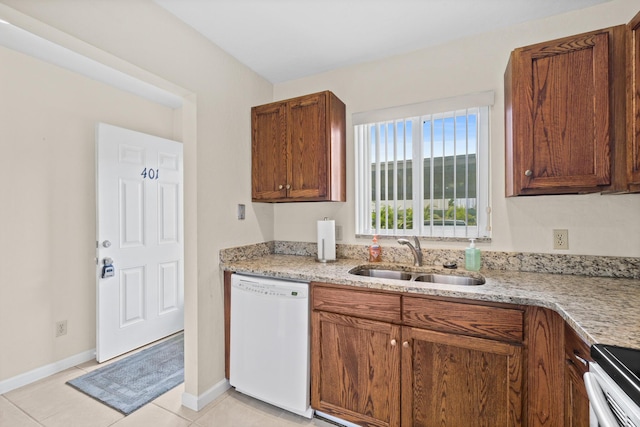 kitchen with stainless steel electric range oven, sink, light stone counters, white dishwasher, and light tile patterned flooring