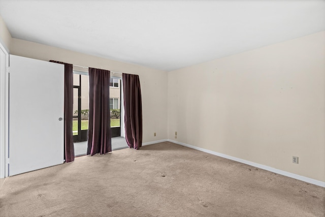 empty room with light colored carpet