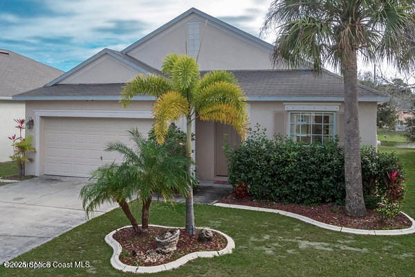 ranch-style home with a front lawn and a garage