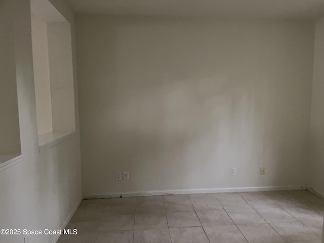 view of tiled spare room