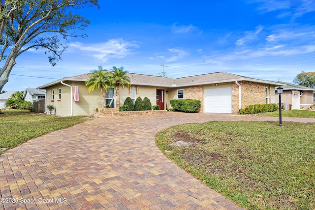 ranch-style home with a front lawn and a garage