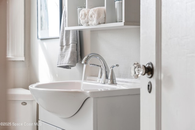 interior space featuring toilet and vanity