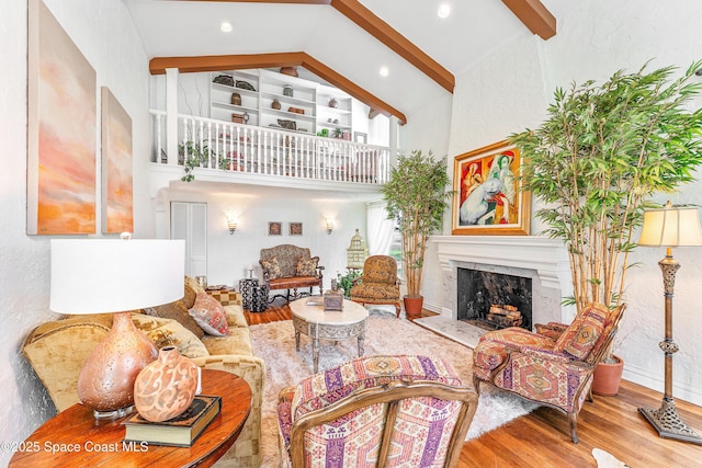 living room featuring high vaulted ceiling, wood-type flooring, and beamed ceiling