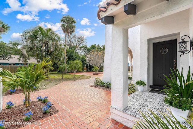 entrance to property featuring a patio