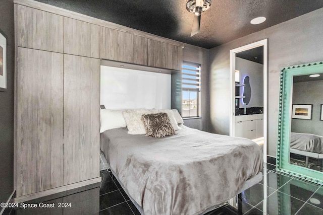 tiled bedroom with ceiling fan