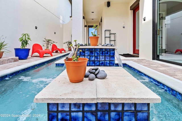 view of pool with a patio