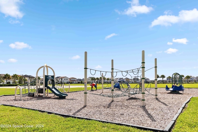 view of play area featuring a lawn