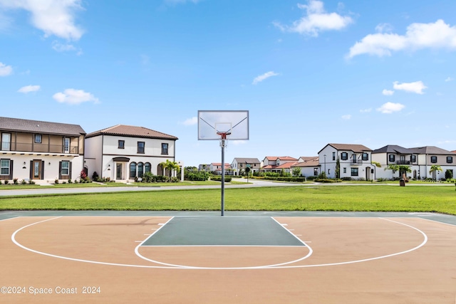 view of basketball court featuring a lawn