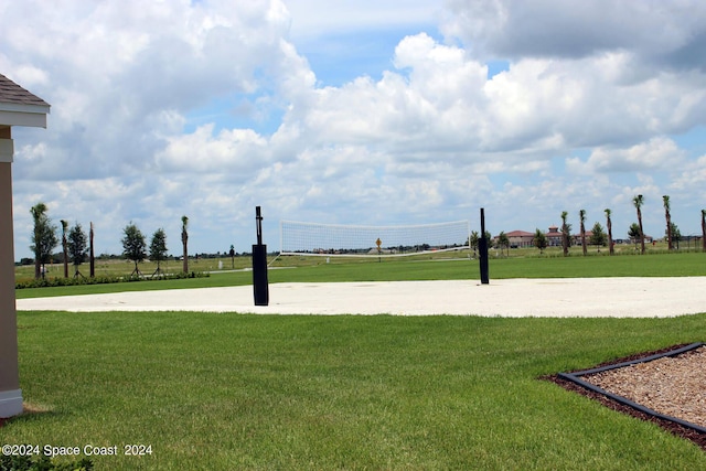 view of property's community featuring volleyball court and a yard