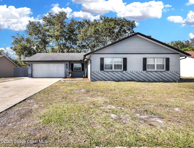 ranch-style home featuring a garage and a front lawn