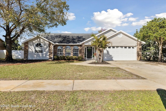 ranch-style house featuring a garage and a front lawn