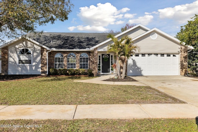 single story home featuring a garage and a front yard