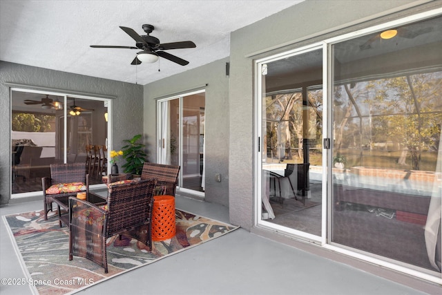 exterior space with ceiling fan