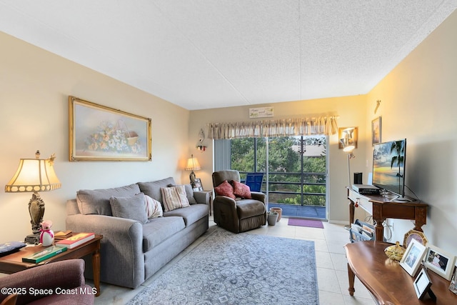 living room featuring a textured ceiling and light tile patterned flooring