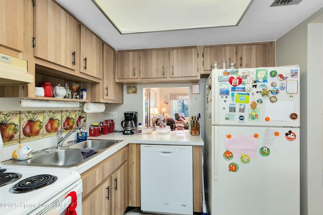 kitchen featuring sink and white appliances