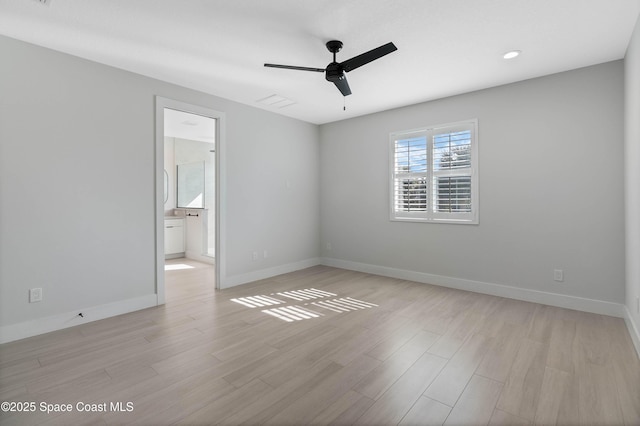 empty room featuring ceiling fan and light wood-type flooring