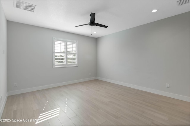 empty room featuring ceiling fan and light wood-type flooring