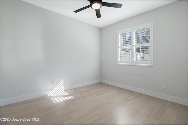 spare room featuring ceiling fan and light hardwood / wood-style flooring