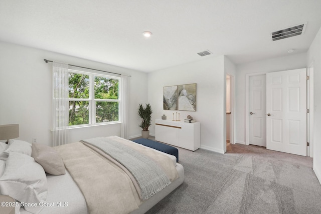 bedroom featuring light carpet