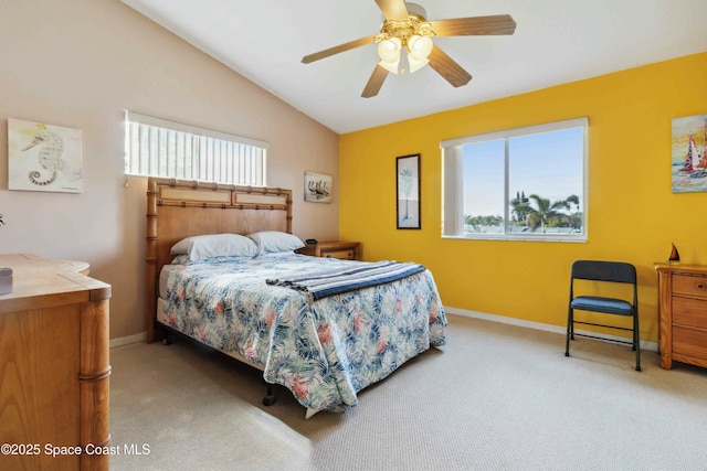 carpeted bedroom featuring ceiling fan and vaulted ceiling