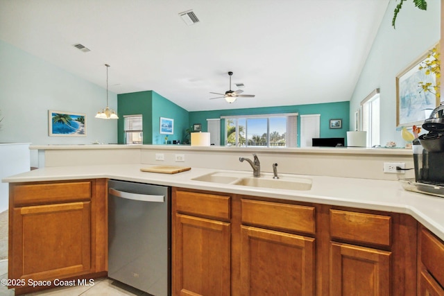 kitchen featuring vaulted ceiling, ceiling fan with notable chandelier, dishwasher, and sink