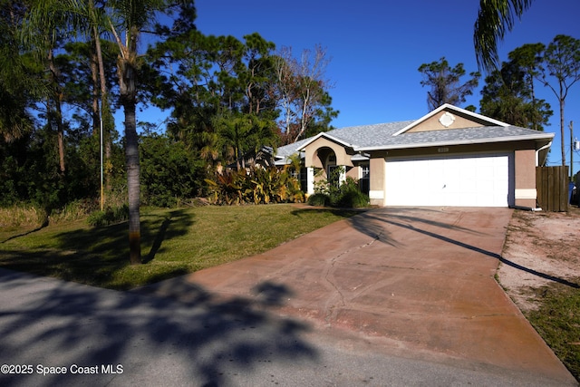 ranch-style house with a front yard and a garage