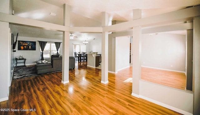 living room featuring ceiling fan, wood-type flooring, and high vaulted ceiling